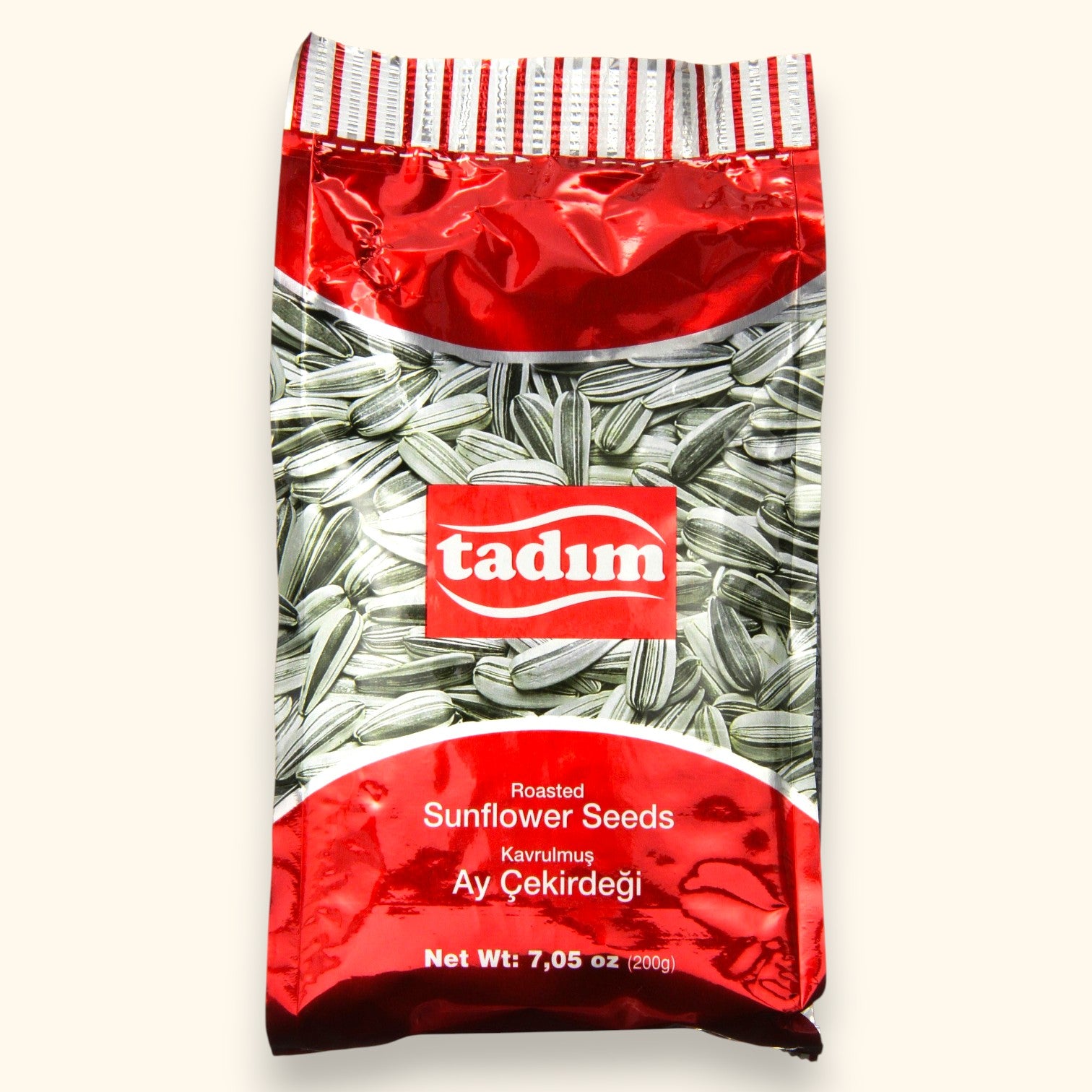 Albasha Tadim Roasted Sunflower Seeds 300G bag with a red and silver design, featuring a close-up of striped sunflower seeds.