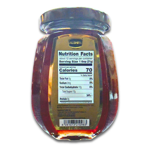 Natural Alshifa Black Forest Honey – 250g in a rustic setting, emphasizing its purity and health benefits, perfect for enhancing wellness.