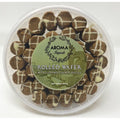 Caramel rolled wafer cookies with Biscoff spread and white chocolate drizzle in a 500g container from Aroma Imports.