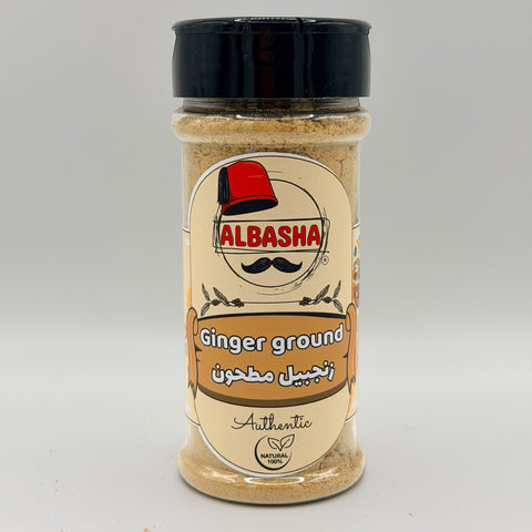 ALBASHA Ground Ginger – Premium Cooking and Baking Spice in a glass jar showcasing the rich texture and vibrant color of finely milled ginger.