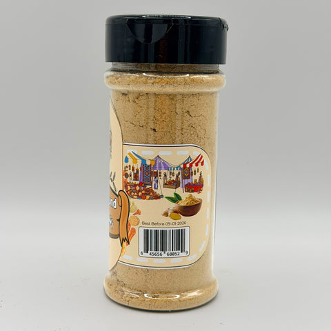 ALBASHA Ground Ginger – Premium Cooking and Baking Spice featured in a bowl with fresh ginger roots in the background, emphasizing its natural flavor and aroma.