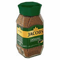 Jacobs Krönung Instantkaffee in a stylish glass jar with dark roasted freeze-dried coffee granules and rich aroma