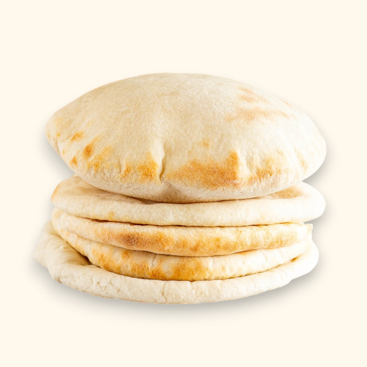 Stack of Albasha Fresh Baked Pita Bread, soft and chewy, on a marble surface
